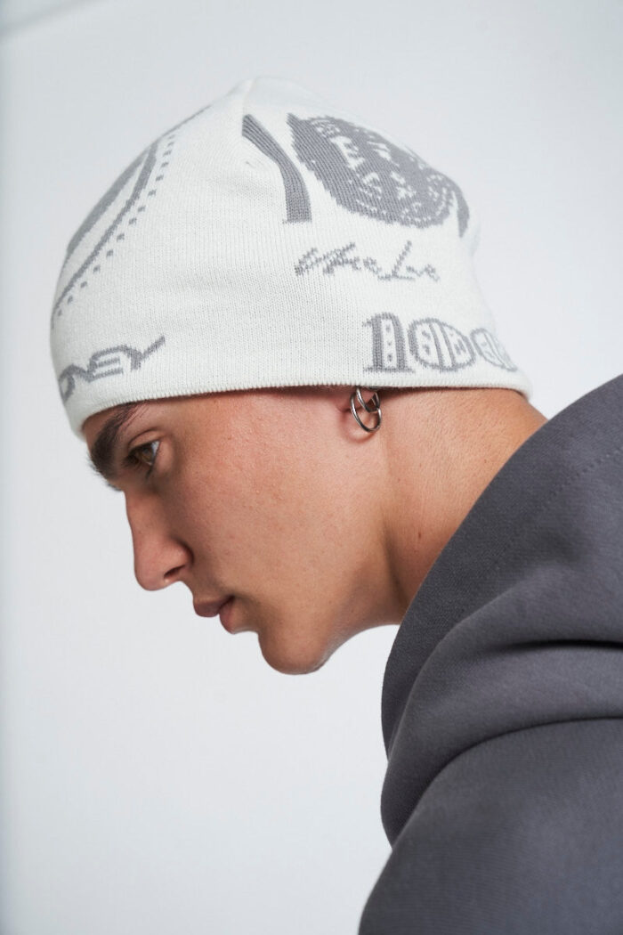 Elevate your winter style with the Banknote Beanie in White.