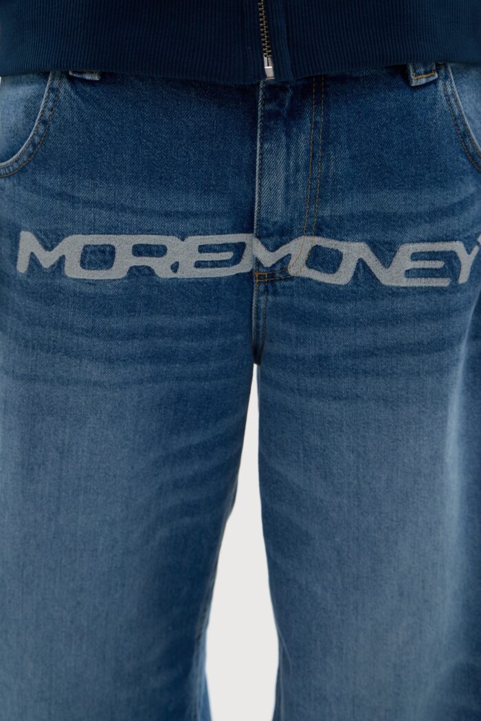 Elevate your style with the More Money Logo Baggy Denim in Blue.