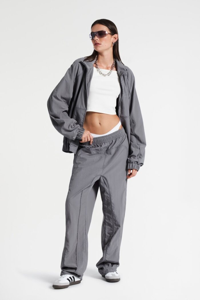 Grey track jacket, a versatile and stylish athletic wear piece perfect for a casual and sporty look.