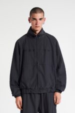 "Black track jacket, a versatile and stylish sporty outerwear piece, perfect for a casual and active look.