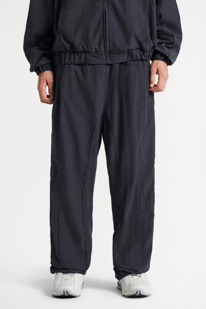 Step into sleek style and comfort with the Track Pants in Black.